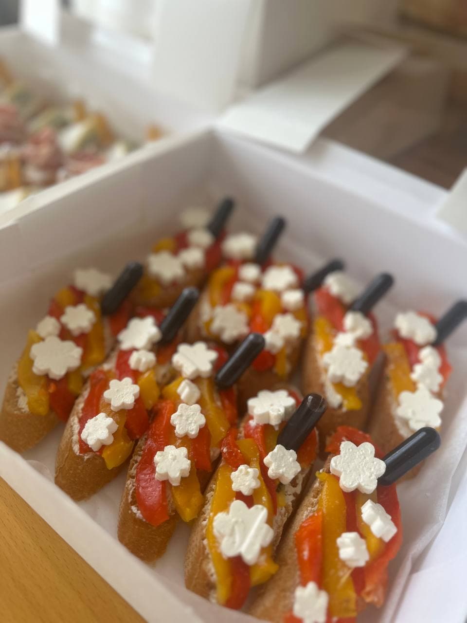 Box Vegetarian Bruschetta with Roasted Peppers and Feta — Gourmet tapas catering delivery in Alicante | Reina de Tapas